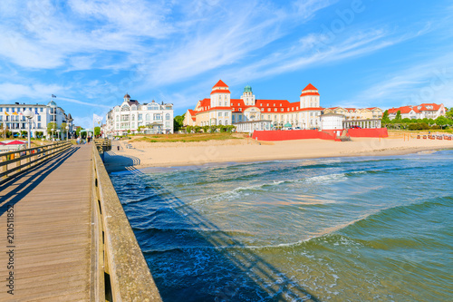 View of historical spa building and sandy beach from pier in Binz summer resort  Ruegen island  Baltic Sea  Germany