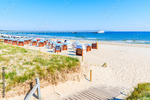 Path to beach with traditional wooden chairs in Binz summer resort, Ruegen island, Baltic Sea, Germany
