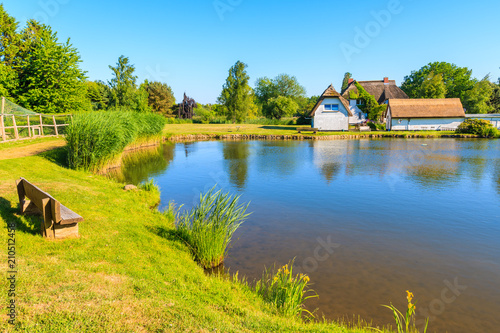 Typical houses with straw roofs on lake shore near Goehren village, Ruegen island, Baltic Sea, Germany