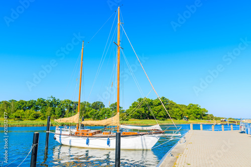 Sailing boat mooring in Schaprode port which is departure place for Hiddensee island, Ruegen island, Baltic Sea, Germany photo