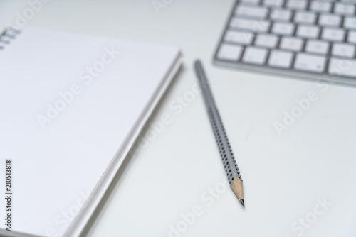 Wallpaper Mural the keyboard, a clipboard and a pencil  on a white surface Torontodigital.ca