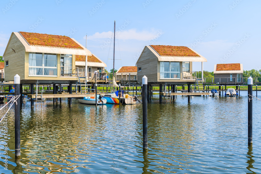 Holiday houses on water in Lauterbach port, Ruegen island, Baltic Sea, Germany