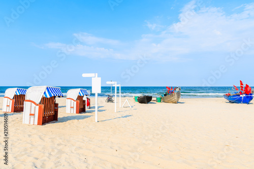 Traditional fishing boats on sandy beach in Baabe summer resort, Ruegen island, Baltic Sea, Germany