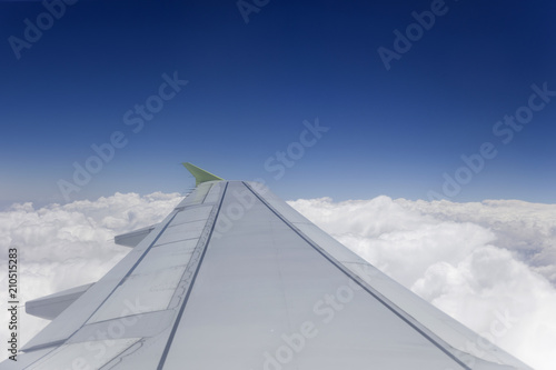 Airplane wing in the sky