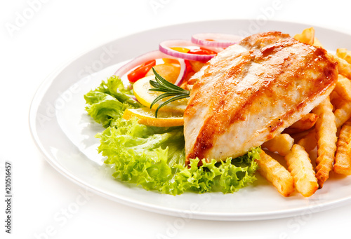 Grilled chicken fillet, chips and vegetable salad