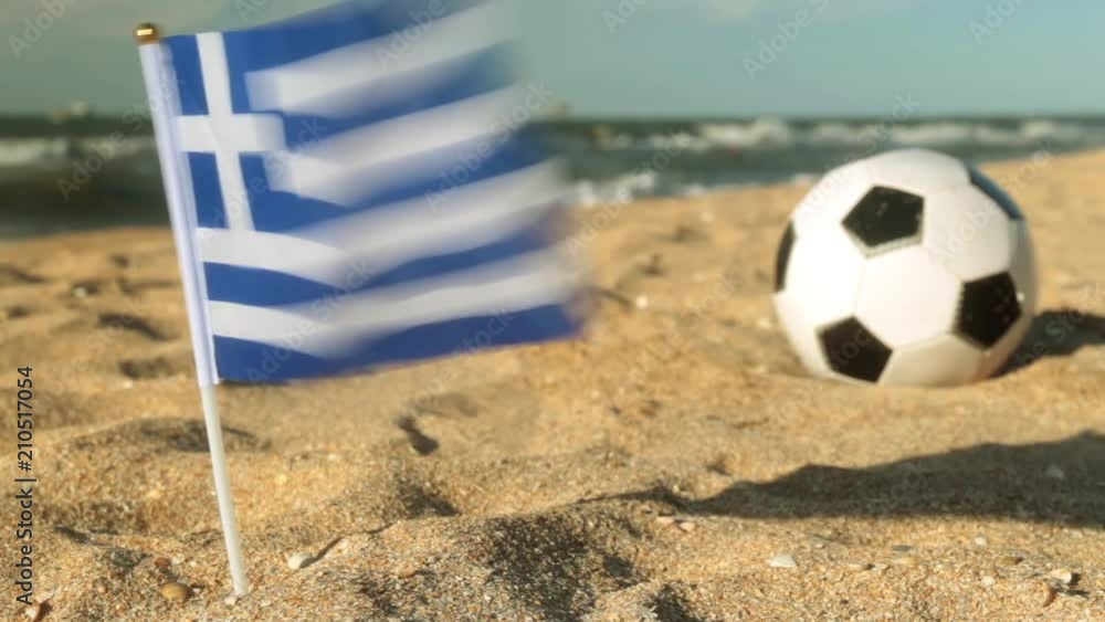 Sandy beach, football ball and the flag of Greece. Sandy beach, football ball and the flag of Greece.