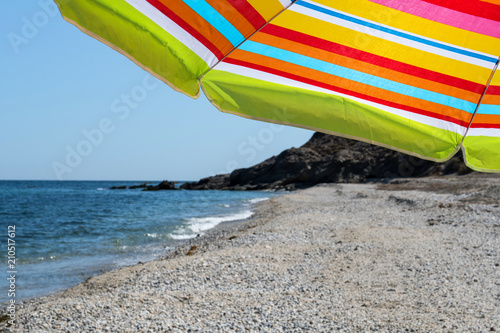Colorful beach umbrella on a sunny day.