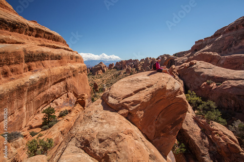 Hiker rests in Arches National park in Utah, USA © Maygutyak