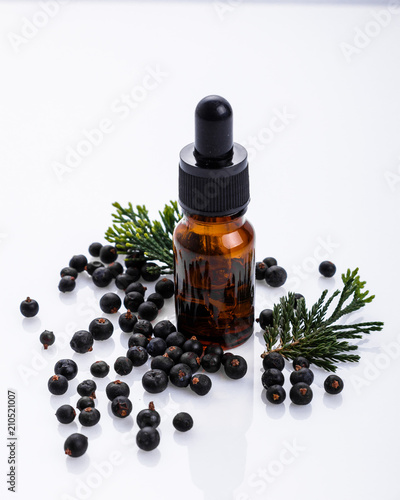 juniper essential oil on a white background