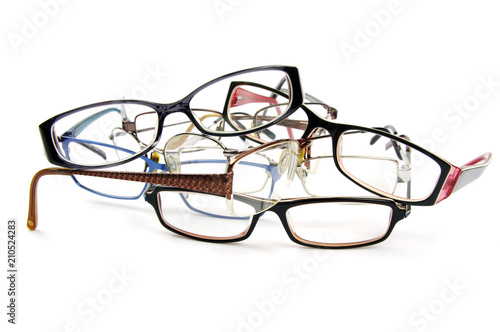 old spectacles in a pile 