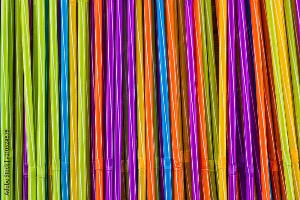 Background of multi-colored drinking straws, close-up Background of multi-colored drinking straws, close-up