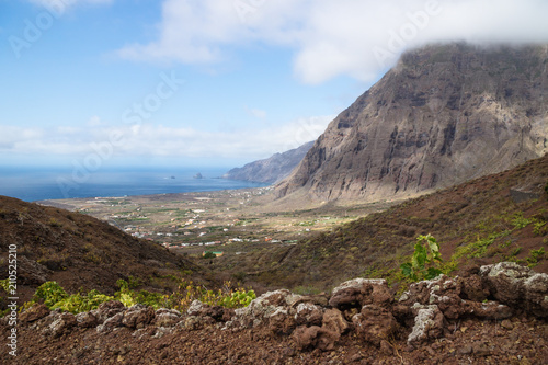 View on the cliffs and red hills of El Golfo valley, Frontera, El Hierro, Canary Islands, Spain photo