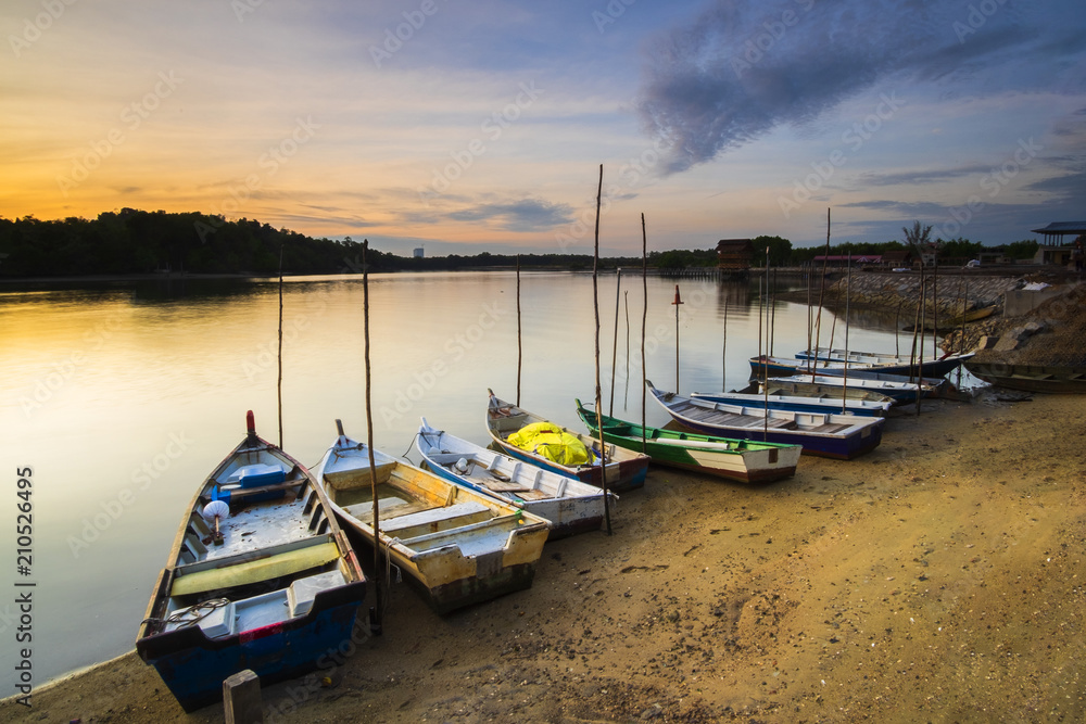 Sunrise Scenery at Lumut Bay,Perak,Malaysia with Resting Boat. Soft focus,Blur due to Long Exposure.
