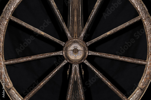 wooden decorative wheel on a black background