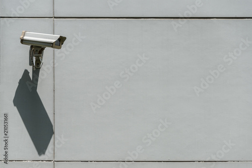 Modern CCTV security camera on the wall. Concept of surveillance and monitoring security camera