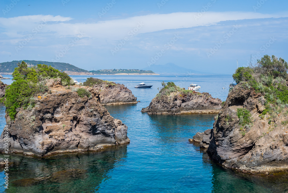 Rock islands in the blue sea with boats - summer holidays