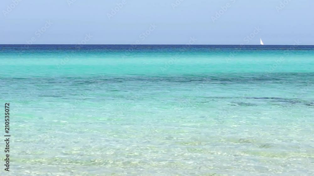 Sailing yacht cruise at the horizon of truquoise blue sea water Sailing yacht cruise at the horizon of truquoise blue sea water