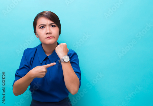 Angry woman check her watch photo