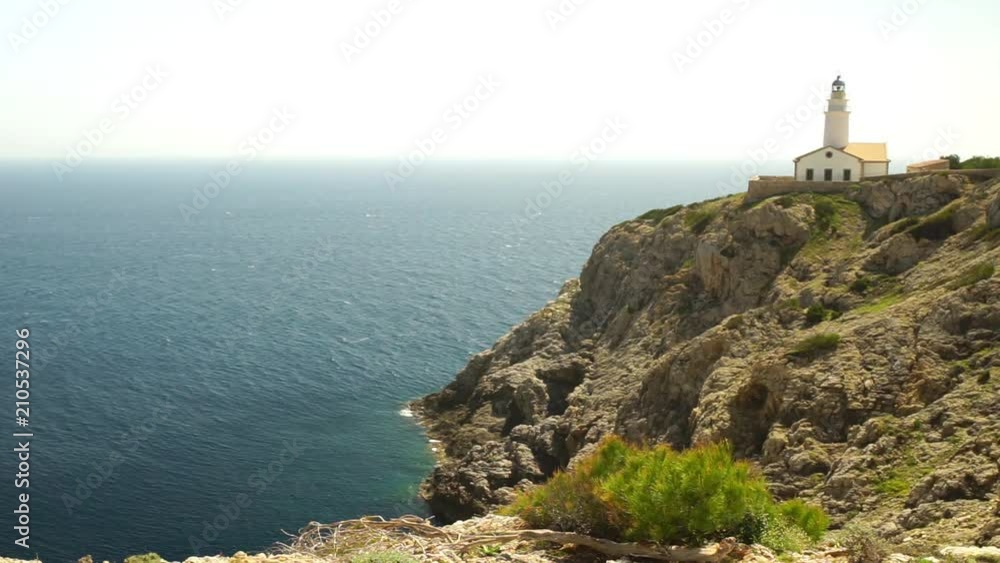 Idyllic view of lighthouse at Cala Rajada, rocky coast cliffs on Mallorca, Spain Mediterranean Sea Idyllic view of lighthouse at Cala Rajada, rocky coast cliffs on Mallorca, Spain Mediterranean Sea