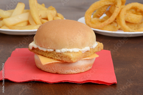 closeup of fillet fish sandwich on red napkin photo