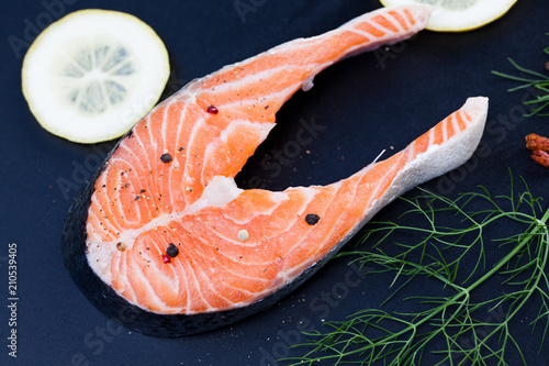 raw salmon fillet with herbs ready for barbecue