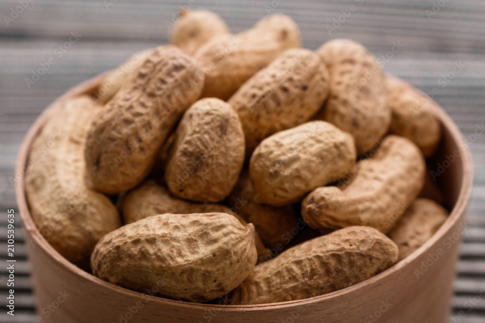 fresh peanuts on a wooden rustic background fresh peanuts on a wooden rustic background