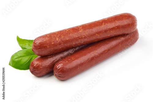 Smoked sausages with fresh herbs, isolated on white background.