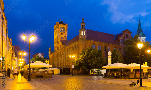 Torun Town Hall and statue of Copernicus in evening