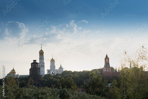 Beautiful panorama day view of Moscow Kremlin with Saint Basil's Cathedral over the console bridge of the park Zaryadie photo