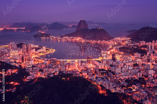 Rio de Janeiro skyline panorama at sunsey, Brazil. Sugarloaf Mountain and Botafogo Bay