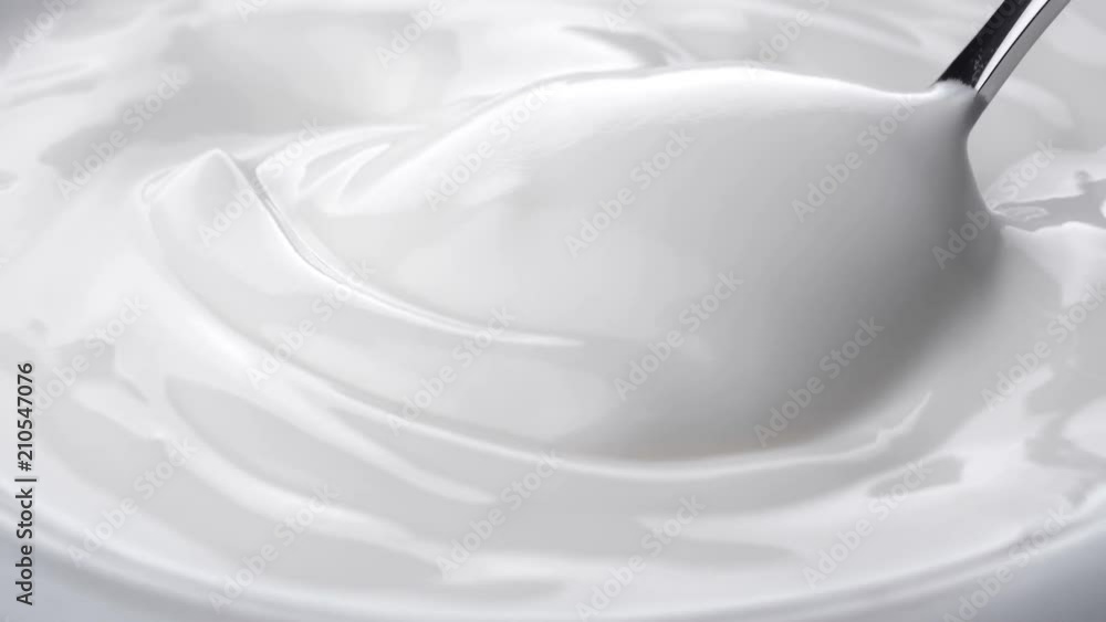 Closeup shot of mixing yogurt with spoon, Rotating
Closeup shot of mixing yogurt with spoon, Rotating