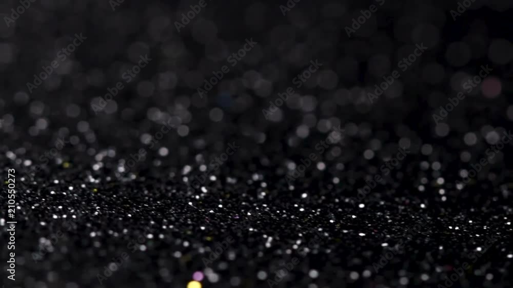 Black glitter texture rotating. Abstract shiny background. Black glitter texture rotating. Abstract shiny background.