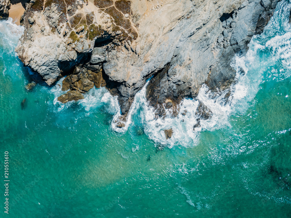 Obraz premium Aerial Drone View Of Dramatic Ocean Waves Crushing On Rocky Landscape