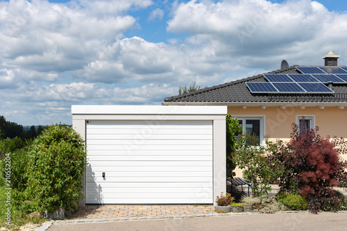 modern entrance area and garage in suburban street