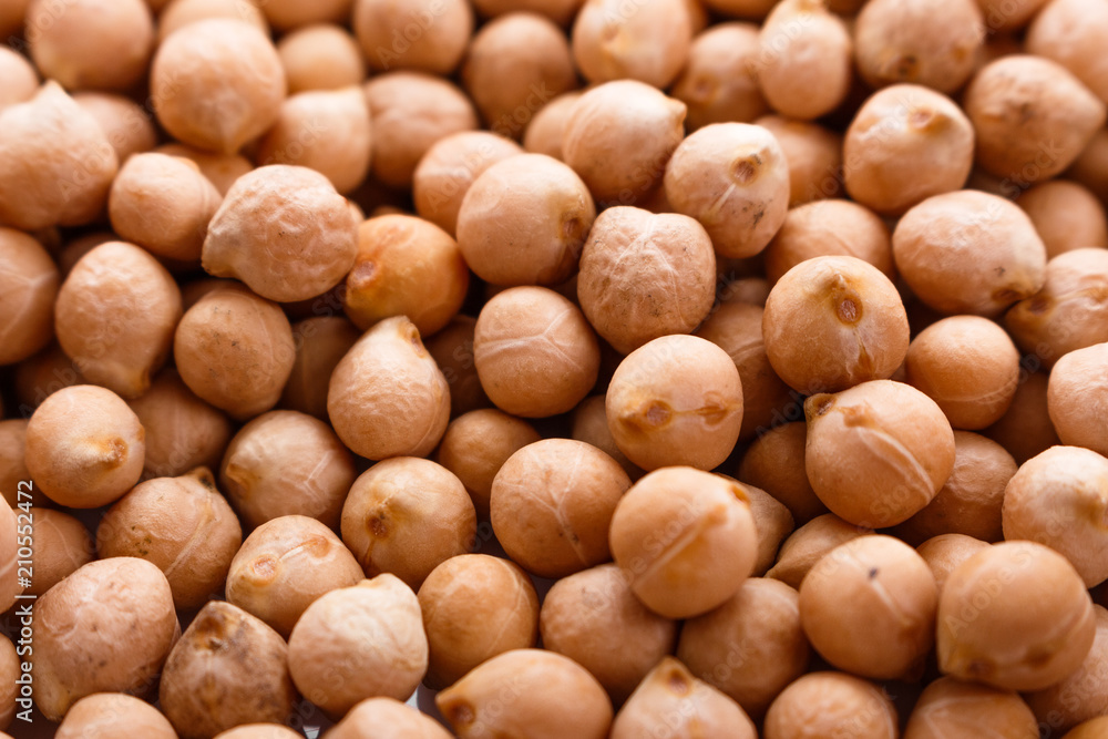 uncooked chickpeas on a white acrylic background uncooked chickpeas on a white acrylic background
