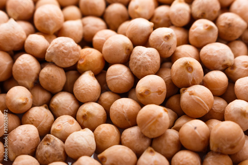 uncooked chickpeas on a white acrylic background