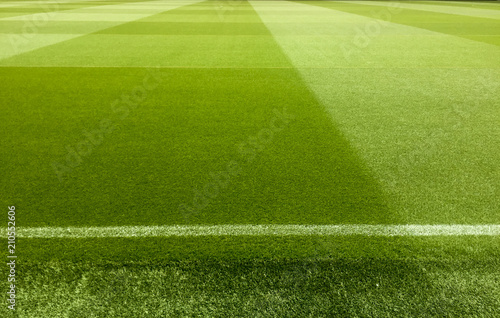 an empty football stadium with green grass