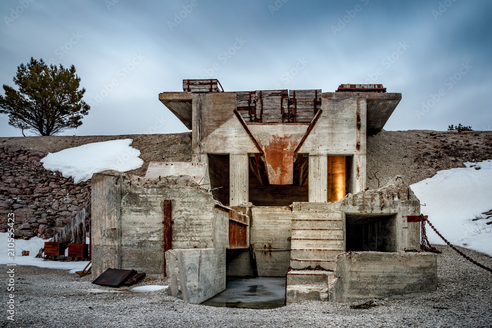 Old broken concrete house at a sand mining company Old broken concrete house at a sand mining company