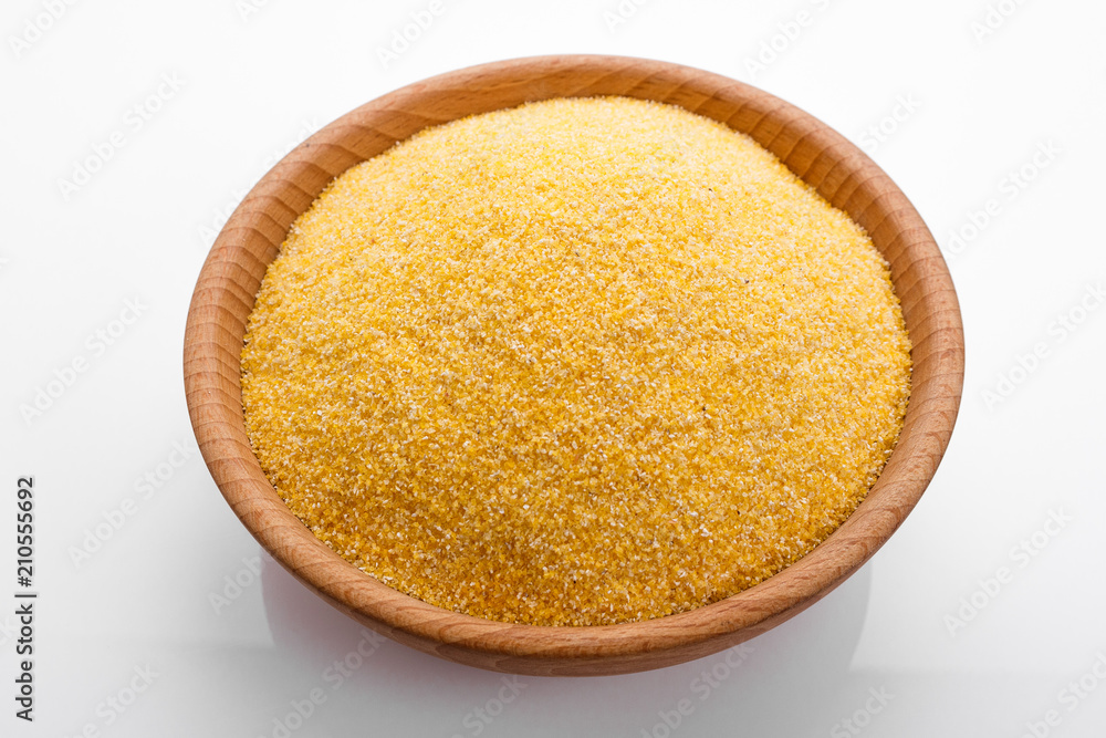 raw Italian corn porridge polenta on a white background raw Italian corn porridge polenta on a white background