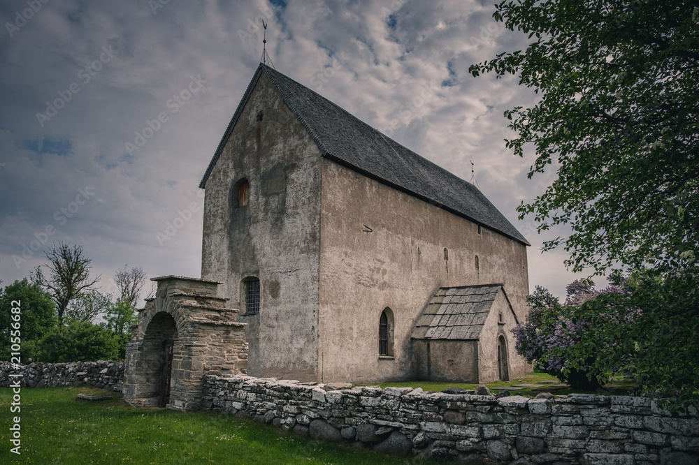 Old stone church with stone wall Old stone church with stone wall