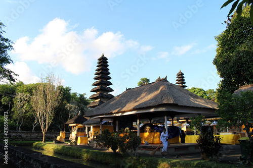 People sweeping around Pura Ayun Temple and garden complex. Peaceful and serene.