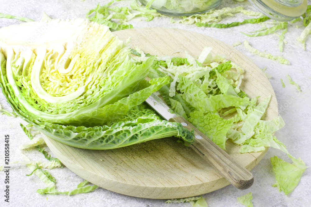 Cut organic cabbage on light background