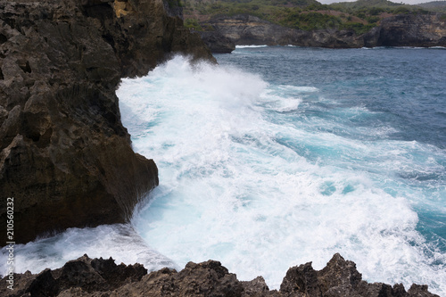 The mass of sea water hits the rocks of the island of Nusa Penida