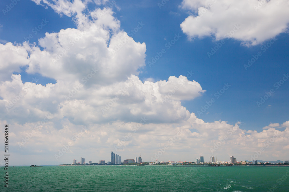 Sea landscape view of city under white cloudy at summer time Sea landscape view of city under white cloudy at summer time