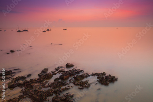 Colorful sky on beautiful beach at sunrise timing located at south of Thailand © pattierstock