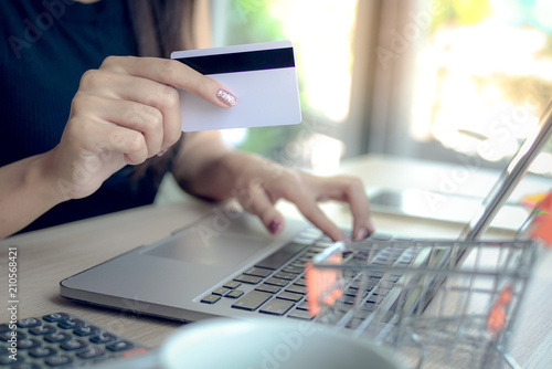 Business Woman use Credit Card to  Shopping Online with Computer Laptop