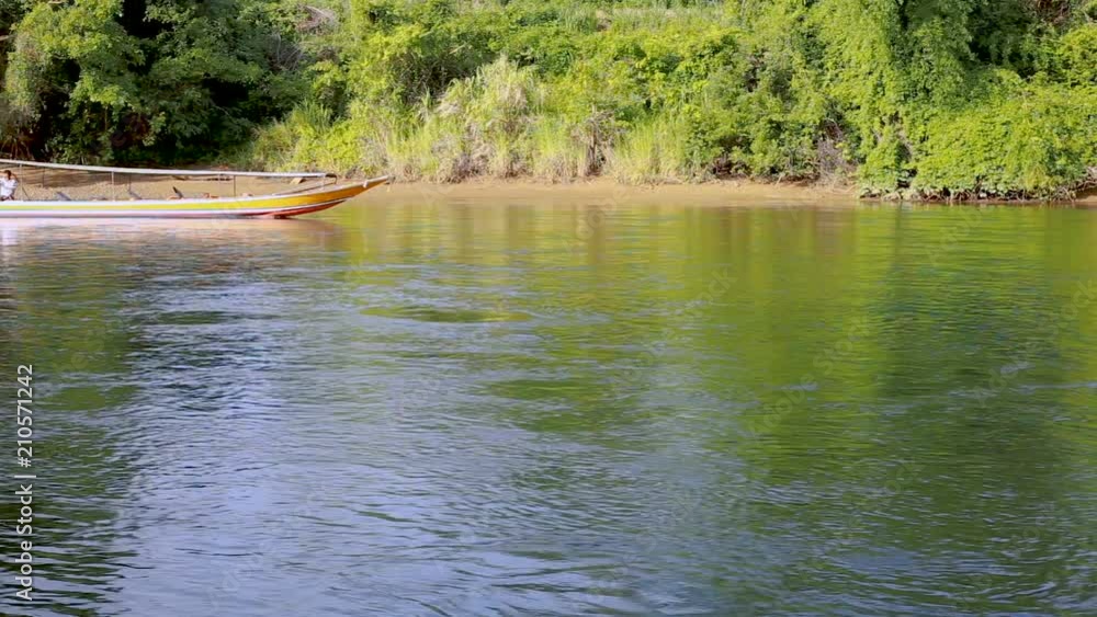 HD long tail boat and raft in the river.