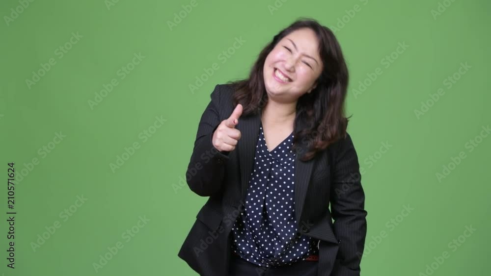 Mature beautiful Asian businesswoman laughing Mature beautiful Asian businesswoman laughing