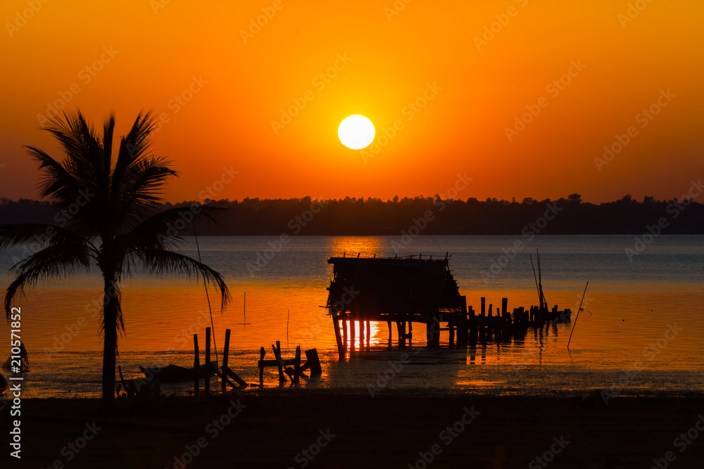 A colorful of sunset timing with palm tree at twilight time located at tropicana north east of Thailand