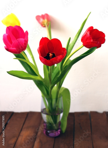 Beautiful bouquet of tulips on old boards.